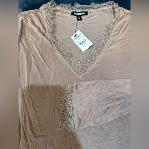 Express fitted shirt with lace trim.